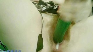 Hot Chinese girl masturbates with a cucumber
