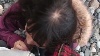 Asian teen gives blowjob and flashes on public beach